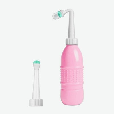 Douchette WC rose avec double tête : tête directe et tête courbée.