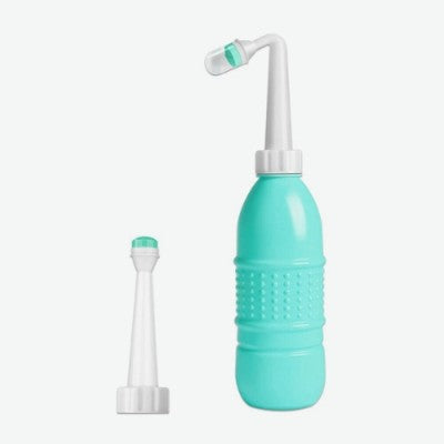 Douchette WC verte avec double tête : tête directe et tête courbée.