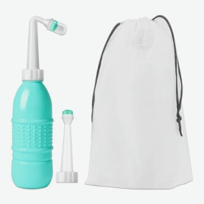 Douchette WC verte avec double tête : tête directe et tête courbée avec sac.