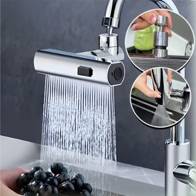 La photo représente le robinet cuisine douchette de couleur argent avec son mode de débit douche qui lave des raisins tenus par une main.  